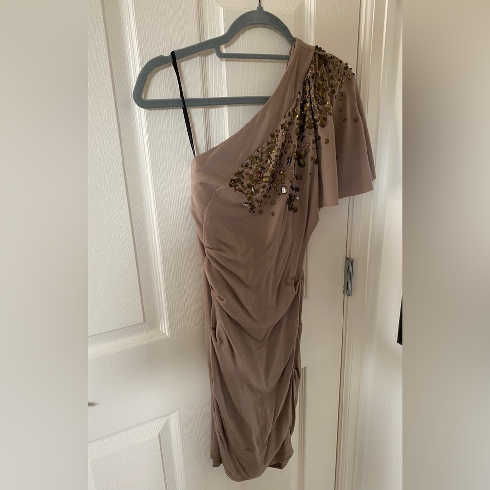 Bebe XS one shoulder tan dress with beads on it.